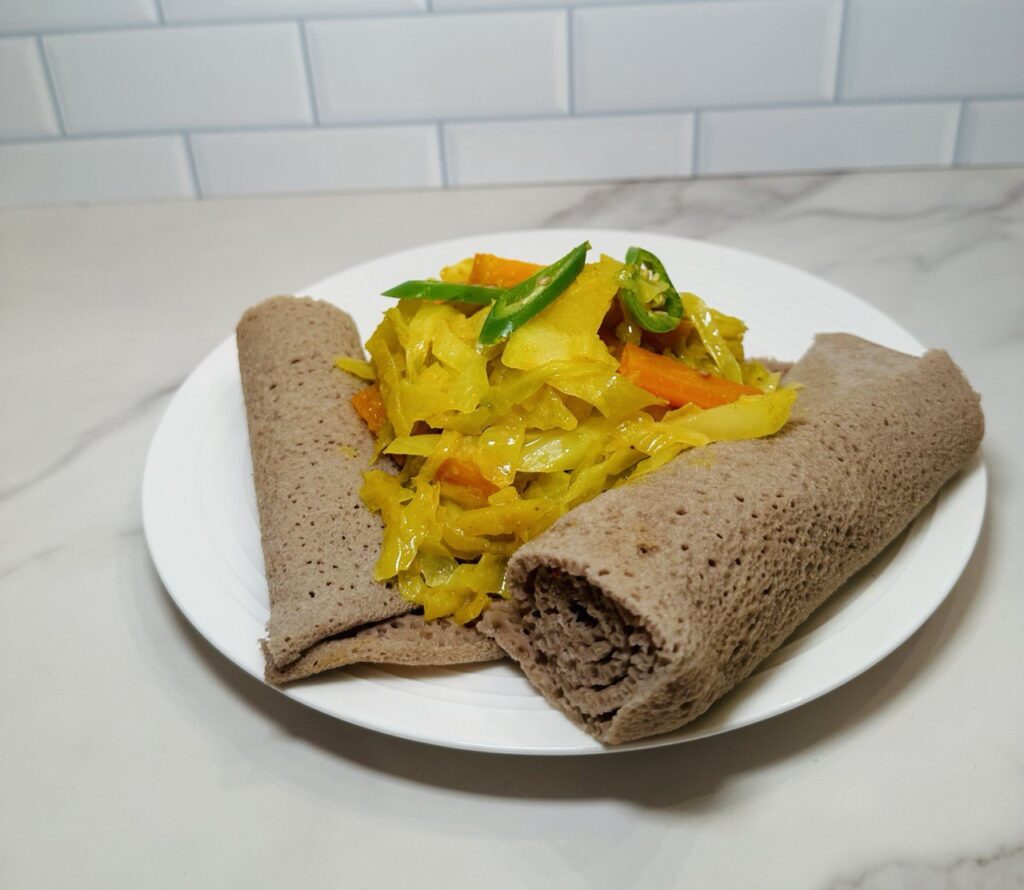 Ethiopian Tikil Gomen Served with Injera