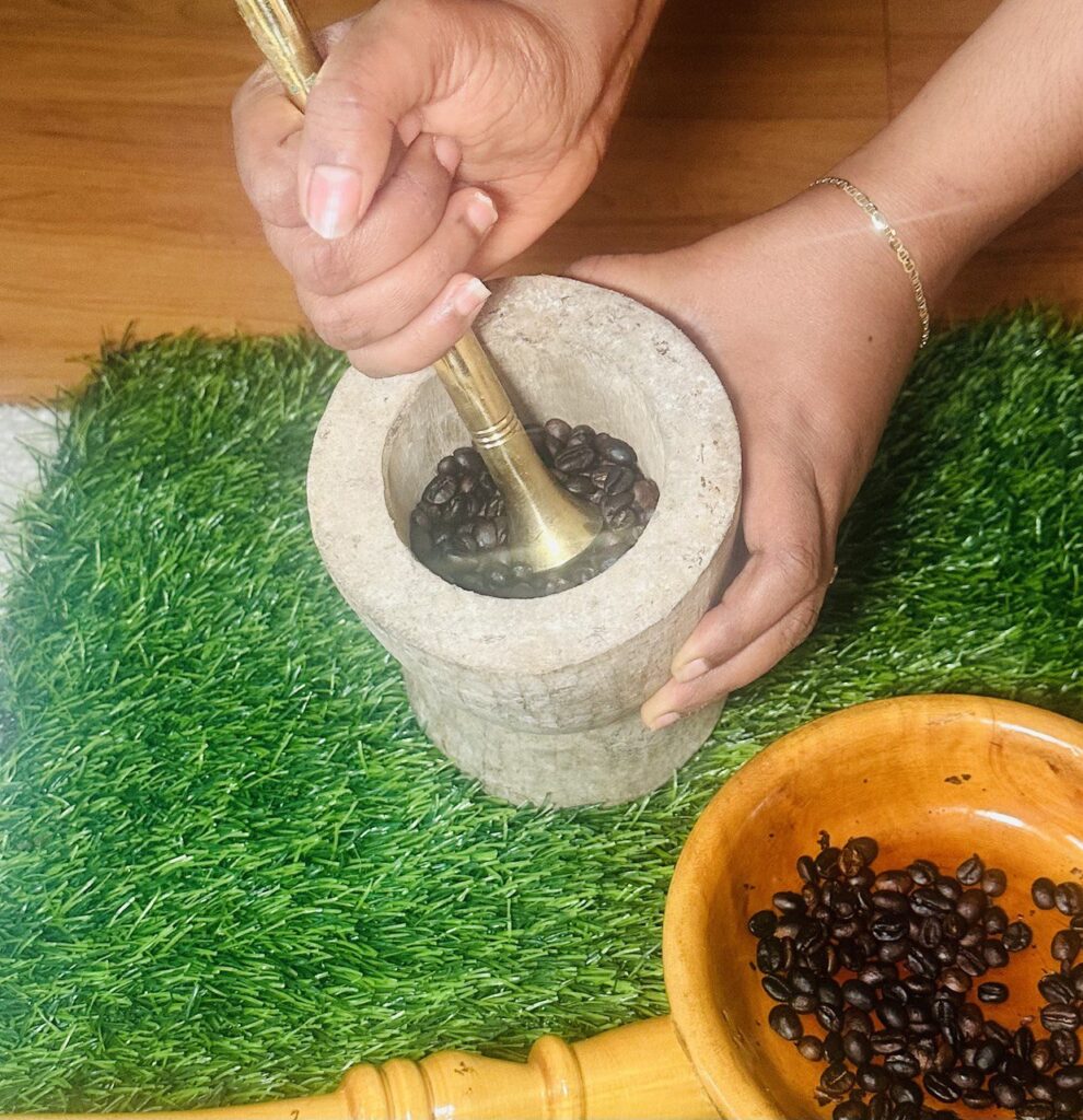 Grinding of coffee in traditional Ethiopian Mukecha