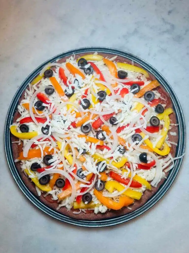 homemade teff-pizza served.