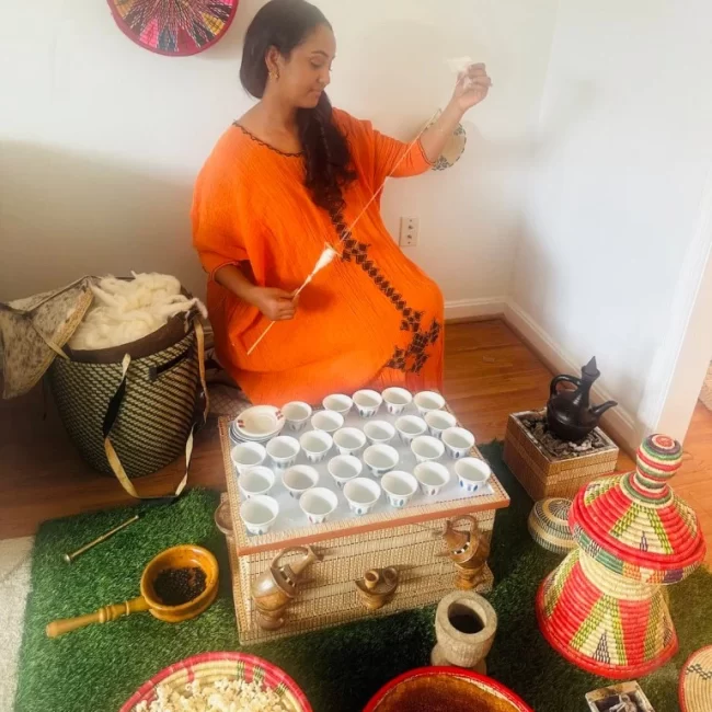 Ethiopian woman preparing the traditional Ethiopian Coffee